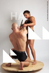 Swimsuit Fighting with gun Woman - Man White Kneeling poses - ALL Muscular Bald Kneeling poses - on one knee Academic
