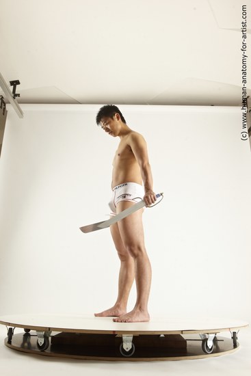 Underwear Fighting with knife Man Asian Average Medium Black Multi angles poses Academic