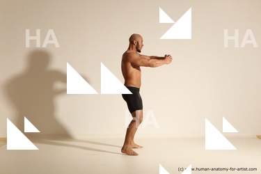 Underwear Gymnastic poses Man Black Muscular Bald Dancing Dynamic poses Academic
