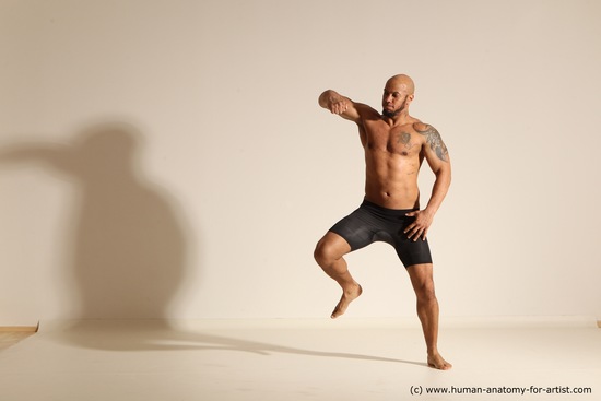 Underwear Gymnastic poses Man Black Muscular Bald Dancing Dynamic poses Academic