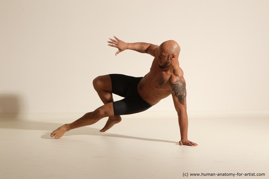 Underwear Gymnastic poses Man Black Muscular Bald Dancing Dynamic poses Academic