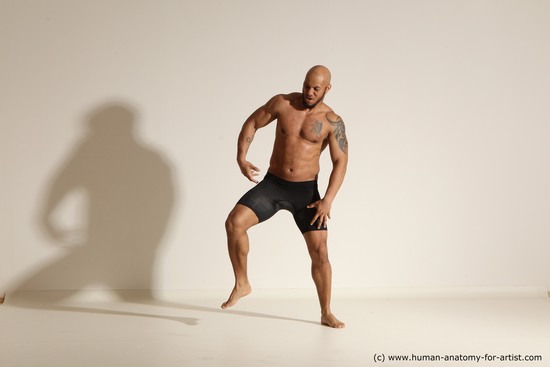 Underwear Gymnastic poses Man Black Muscular Bald Dancing Dynamic poses Academic