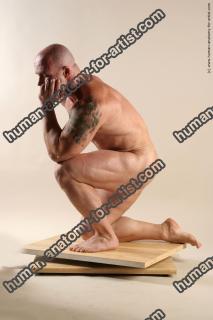 Bodybuilder Kneeling