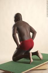 Underwear Man Black Kneeling poses - ALL Average Bald Kneeling poses - on both knees Academic