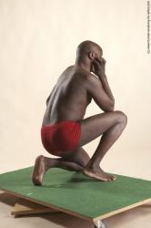 Underwear Man Black Kneeling poses - ALL Average Bald Kneeling poses - on one knee Academic