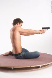 Casual Fighting with gun Man White Sitting poses - simple Slim Short Brown Sitting poses - ALL Academic