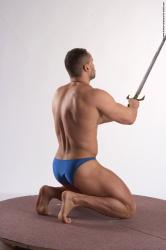 Swimsuit Fighting with sword Man White Kneeling poses - ALL Muscular Short Brown Kneeling poses - on both knees Academic