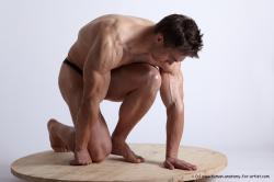 Swimsuit Man White Kneeling poses - ALL Muscular Short Brown Kneeling poses - on one knee Academic