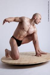 Swimsuit Man White Kneeling poses - ALL Muscular Bald Kneeling poses - on one knee Academic