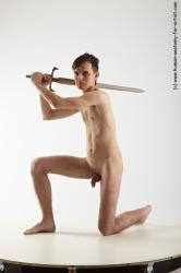Nude Fighting with sword Man White Kneeling poses - ALL Slim Short Brown Kneeling poses - on one knee Realistic