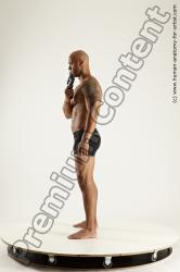 Underwear Fighting with gun Man Black Sitting poses - simple Muscular Bald Sitting poses - ALL Multi angles poses Academic