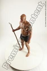Underwear Fighting with spear Man Black Sitting poses - simple Muscular Bald Sitting poses - ALL Multi angles poses Academic