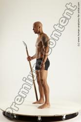 Underwear Fighting with spear Man Black Sitting poses - simple Muscular Bald Sitting poses - ALL Multi angles poses Academic