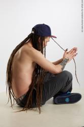 Casual Man White Sitting poses - simple Average Brown Sitting poses - ALL Dreadlocks Standard Photoshoot Academic