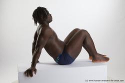 Underwear Man Black Sitting poses - simple Muscular Black Sitting poses - ALL Dreadlocks Standard Photoshoot Academic